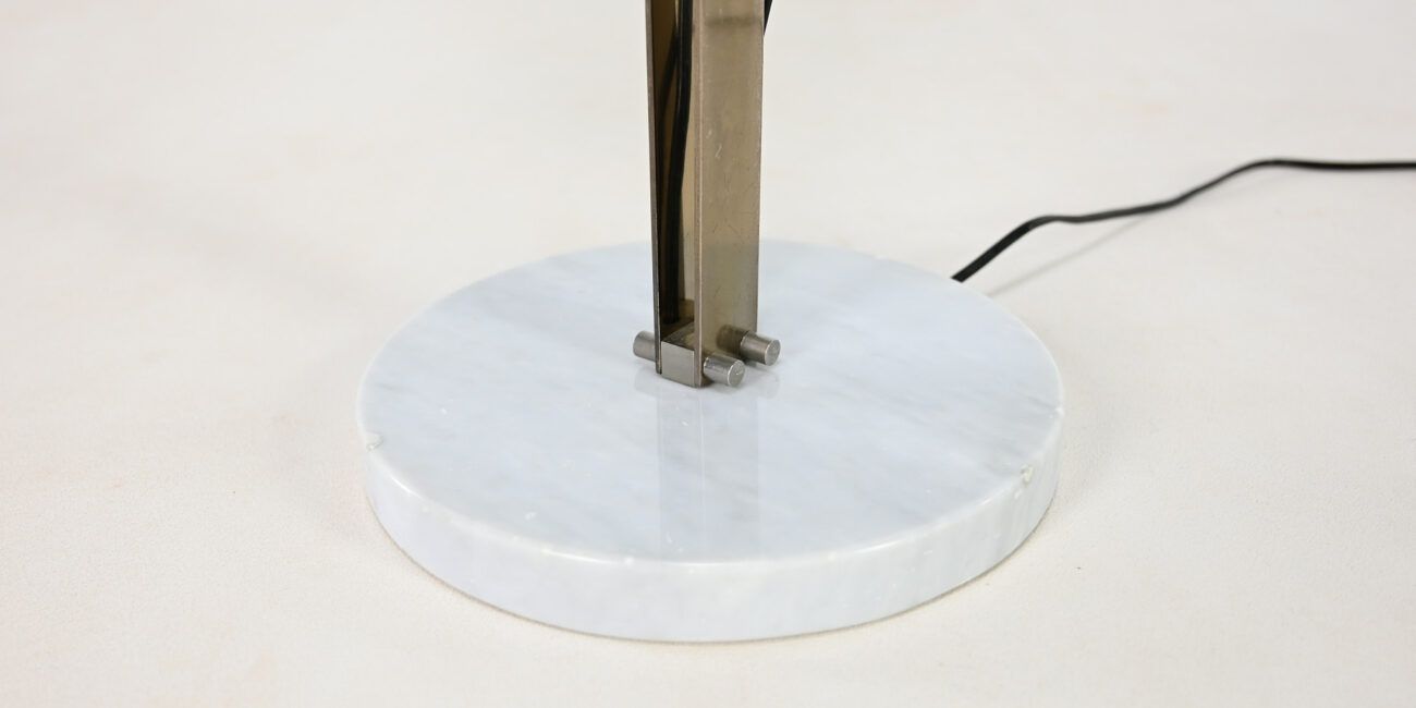 Sculptural floor lamp, by Italian designer Goffredo Reggiani during the 60's. Structure made of steel resting on a round carrare marble base and supporting an ovoid shaped orientable copper reflector with an acrylic glass diffuser.