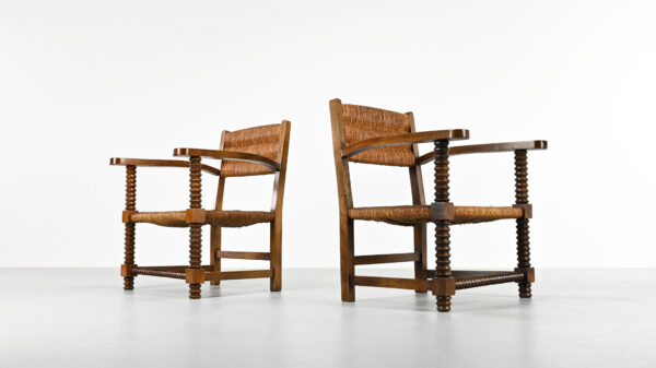 Pair of rustic vintage armchairs in the manner of Charles Dudouyt with corkscrew style front legs